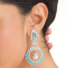 "Aqua zircon earrings with a captivating hue bring elegance and sparkle to your look."
