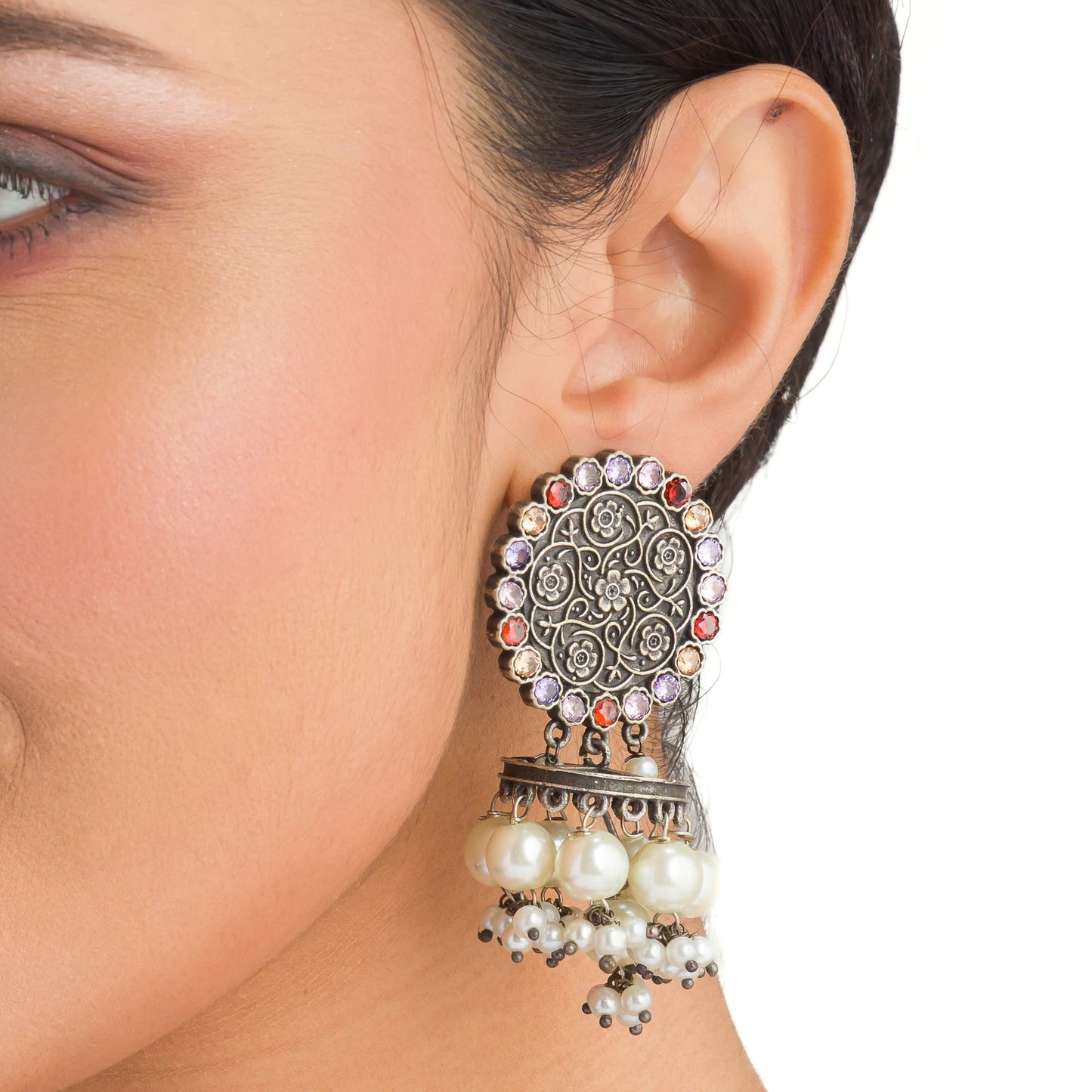 "OXIDIZED EARRINGS WITH MULTI-COLOR STONES AND PEARLS ADD A VIBRANT, BOHEMIAN TOUCH."