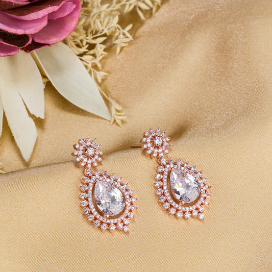 "ROSE GOLD EARRING ADORNED WITH ZIRCON ADDS A TOUCH OF ELEGANCE AND SPARKLE TO ANY EAR."