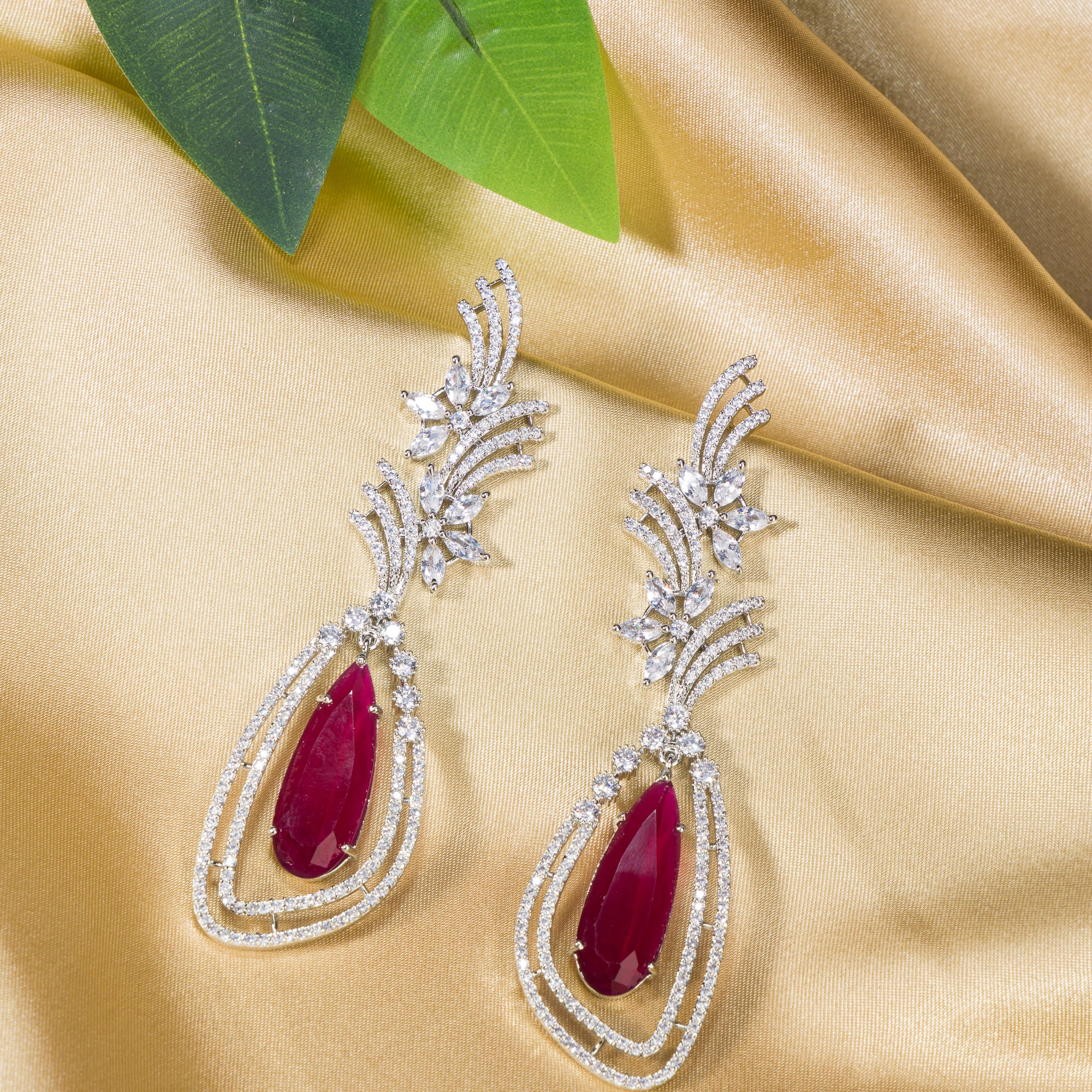 "Light pink zircon earrings offer a delicate sparkle with a serene, elegant touch."
