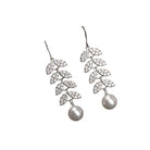 1. "Zircon leaf earrings capture nature's elegance with sparkling, intricate details."
