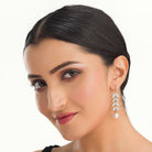 1. "Zircon leaf earrings capture nature's elegance with sparkling, intricate details."
