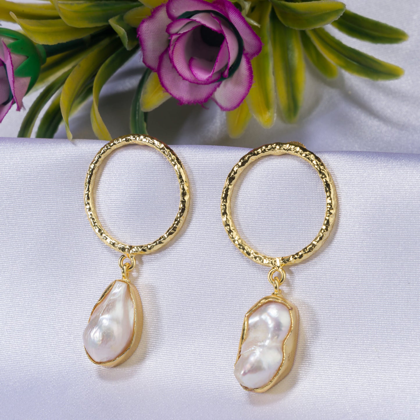 "GOLDEN EARRINGS WITH WHITE UNCUT STONES BLEND CLASSIC ELEGANCE WITH MODERN FLAIR."