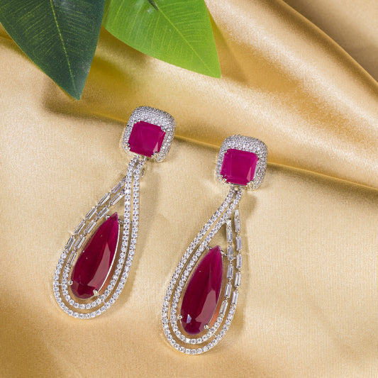 "DARK PINK ZIRCON STUDDED EARRINGS OFFERS A FRESH, DELICATE SPARKLE WITH A HINT OF SERENE ELEGANCE."