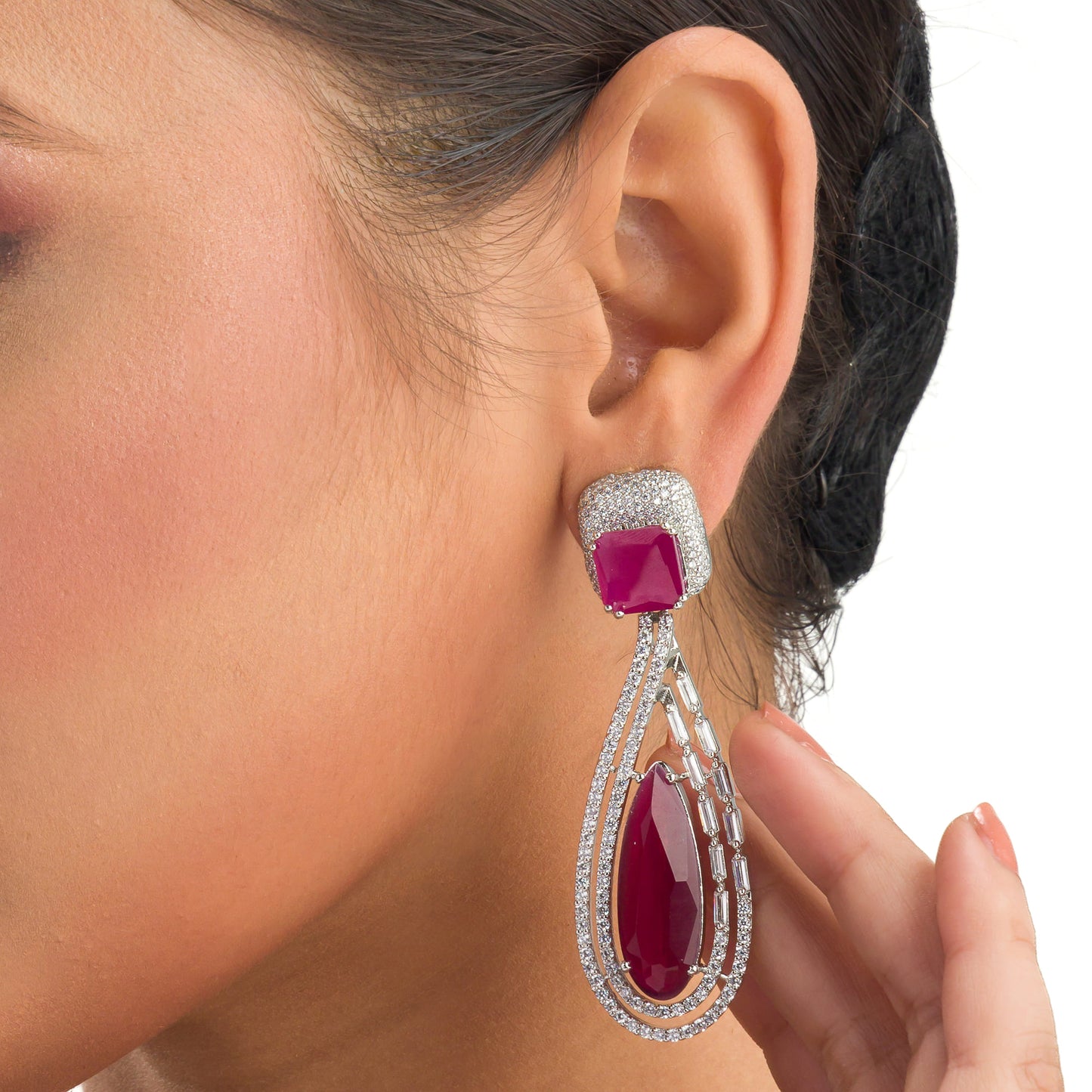 "DARK PINK ZIRCON STUDDED EARRINGS OFFERS A FRESH, DELICATE SPARKLE WITH A HINT OF SERENE ELEGANCE."