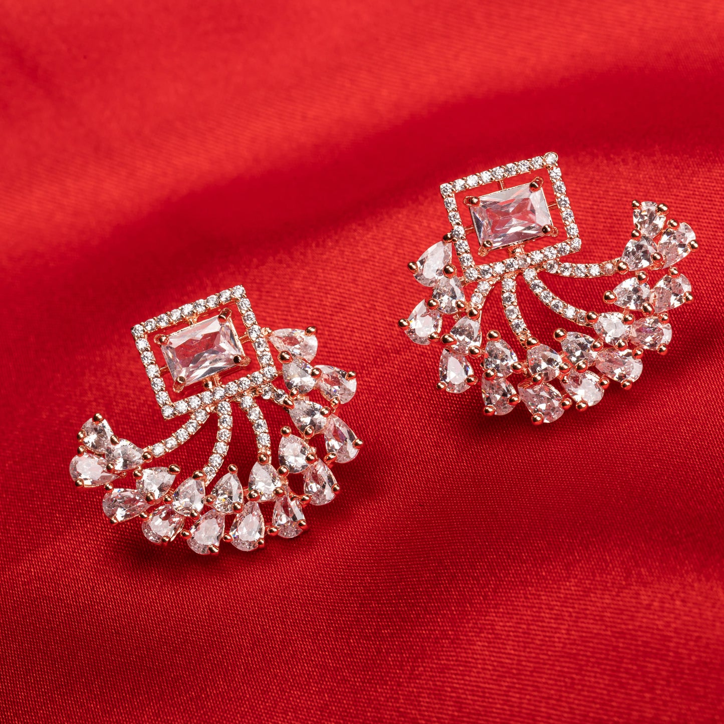 "ROSE GOLD ZIRCON EARRINGS OFFER A CHIC, LUSTROUS SPARKLE WITH A TOUCH OF REFINED GLAMOUR."