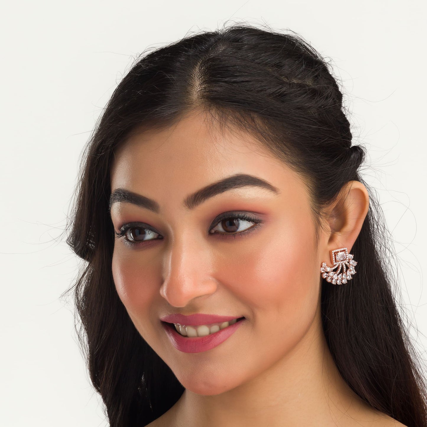 "ROSE GOLD ZIRCON EARRINGS OFFER A CHIC, LUSTROUS SPARKLE WITH A TOUCH OF REFINED GLAMOUR."