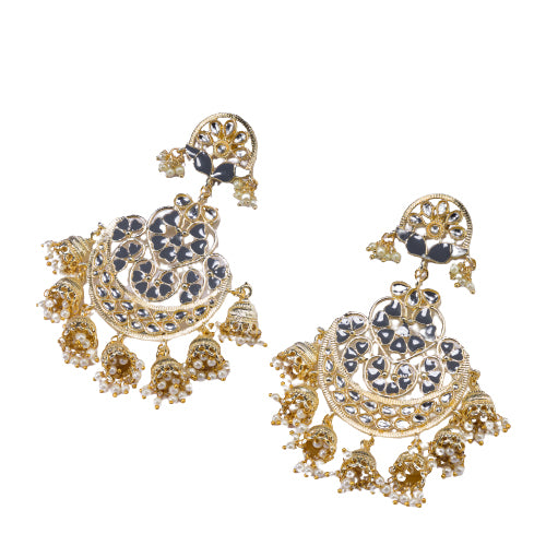 "Kundan earrings with white pearls offer a regal, timeless charm for any occasion."
