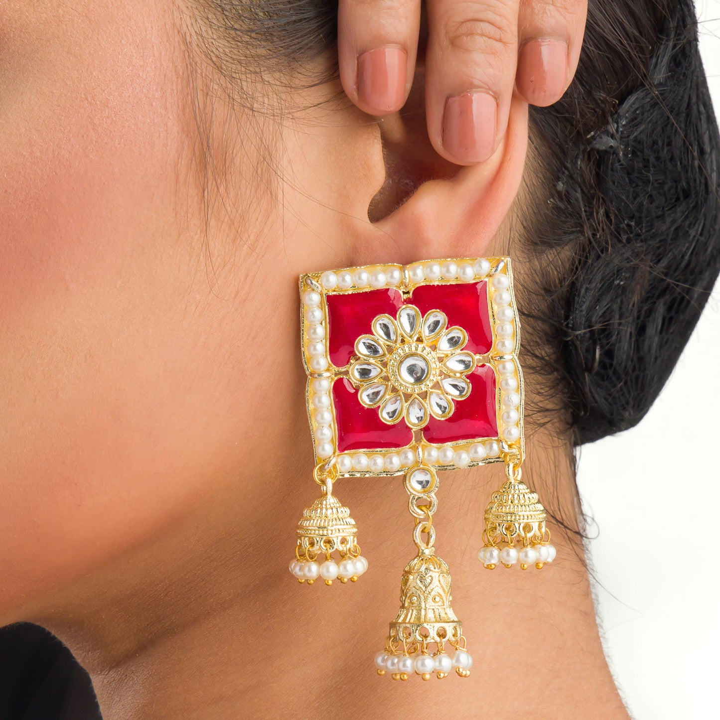 "RED SQUARE GOLD JHUMKA BLENDS BOLD COLOR WITH CLASSIC ELEGANCE FOR A STRIKING LOOK."