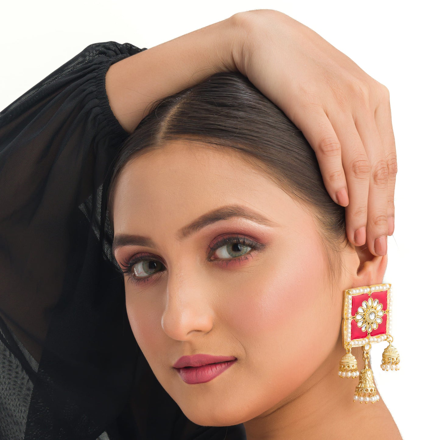 "RED SQUARE GOLD JHUMKA BLENDS BOLD COLOR WITH CLASSIC ELEGANCE FOR A STRIKING LOOK."