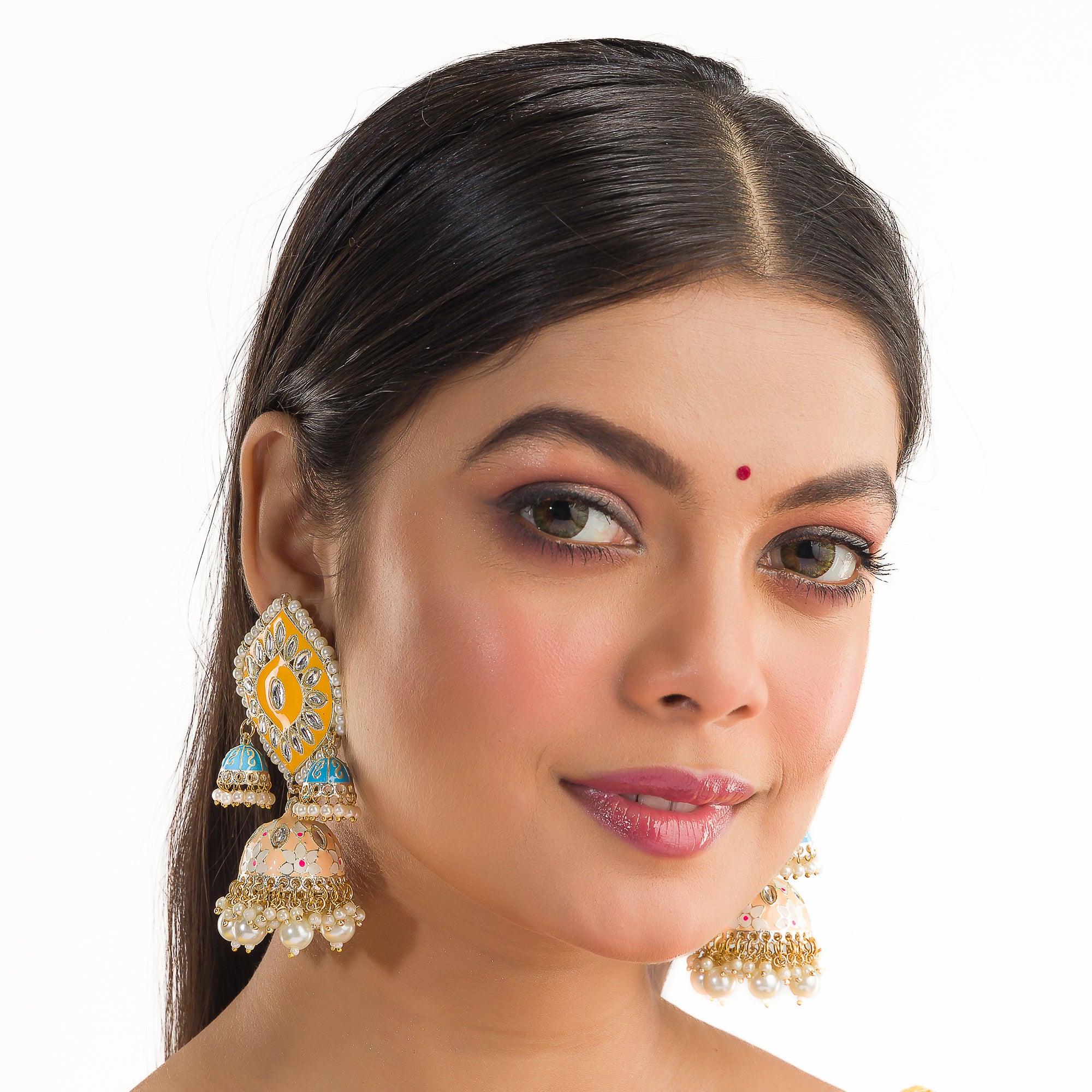 "Yellow and blue gold jhumka earrings blend bold colors with classic elegance for a striking look."
