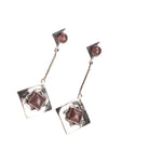 "Trendy oxidized metal dangler earrings add a sleek, modern edge to any outfit."
