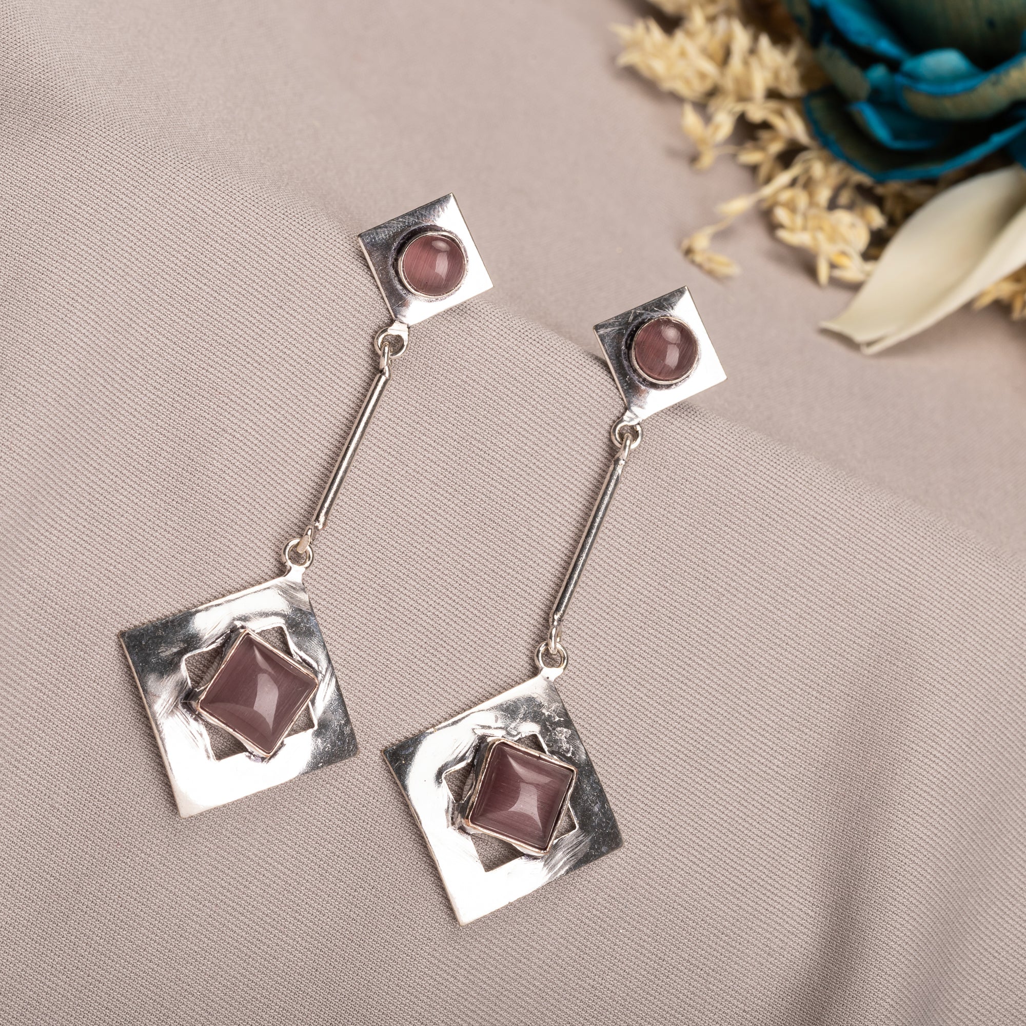 "Trendy oxidized metal dangler earrings add a sleek, modern edge to any outfit."
