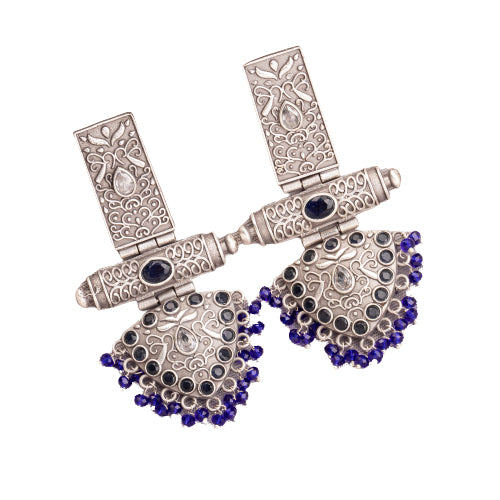 "Oxidized earrings with blue beads offer a unique vintage touch and a pop of color."
