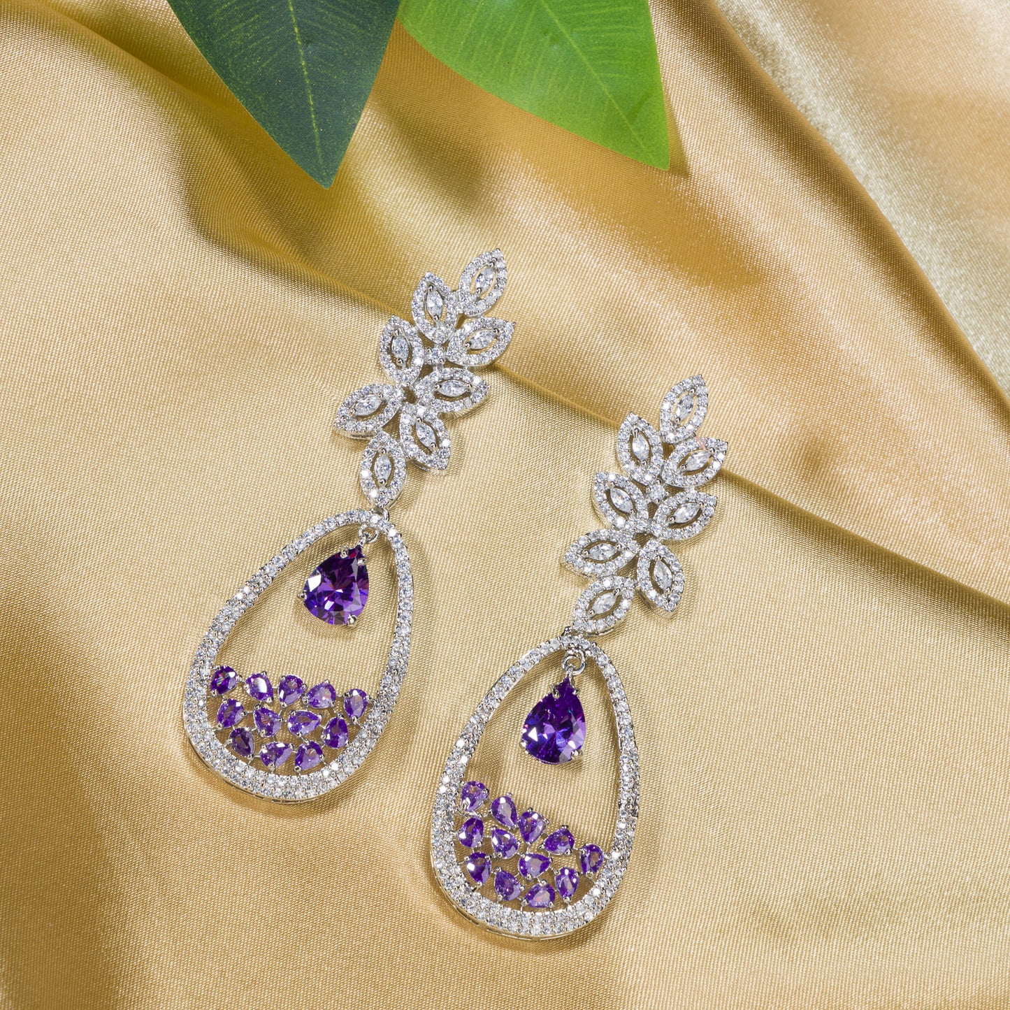 PURPLE AND WHITE COLOURED  ZIRCON DANGLER EARRINGS EXUDE A DEEP, CAPTIVATING SPARKLE