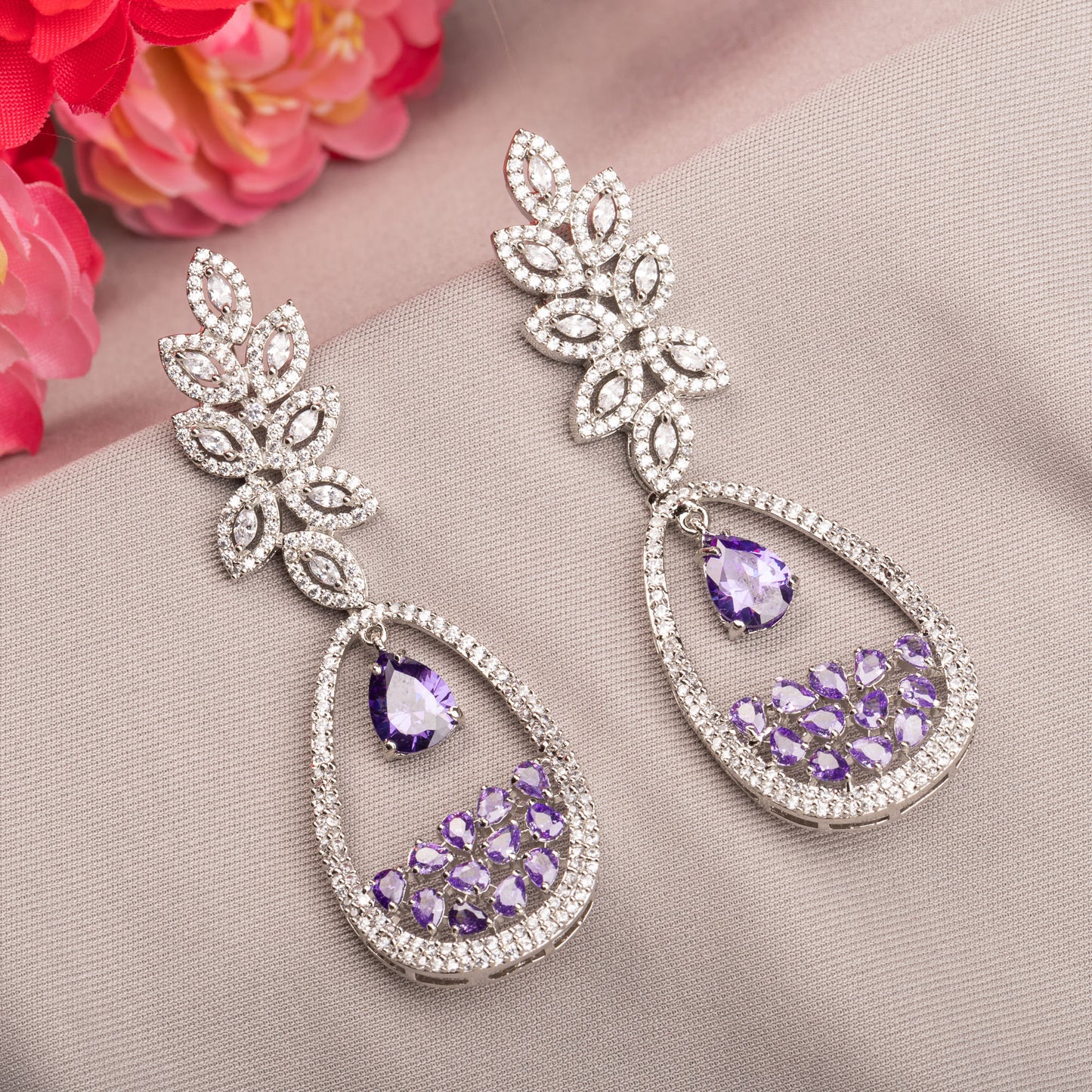 PURPLE AND WHITE COLOURED  ZIRCON DANGLER EARRINGS EXUDE A DEEP, CAPTIVATING SPARKLE