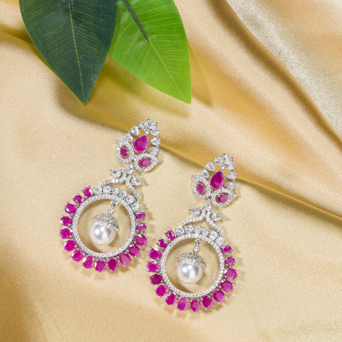 "PINK ZIRCON STUDDED EARRINGS OFFERS A FRESH, DELICATE SPARKLE WITH A HINT OF SERENE ELEGANCE."