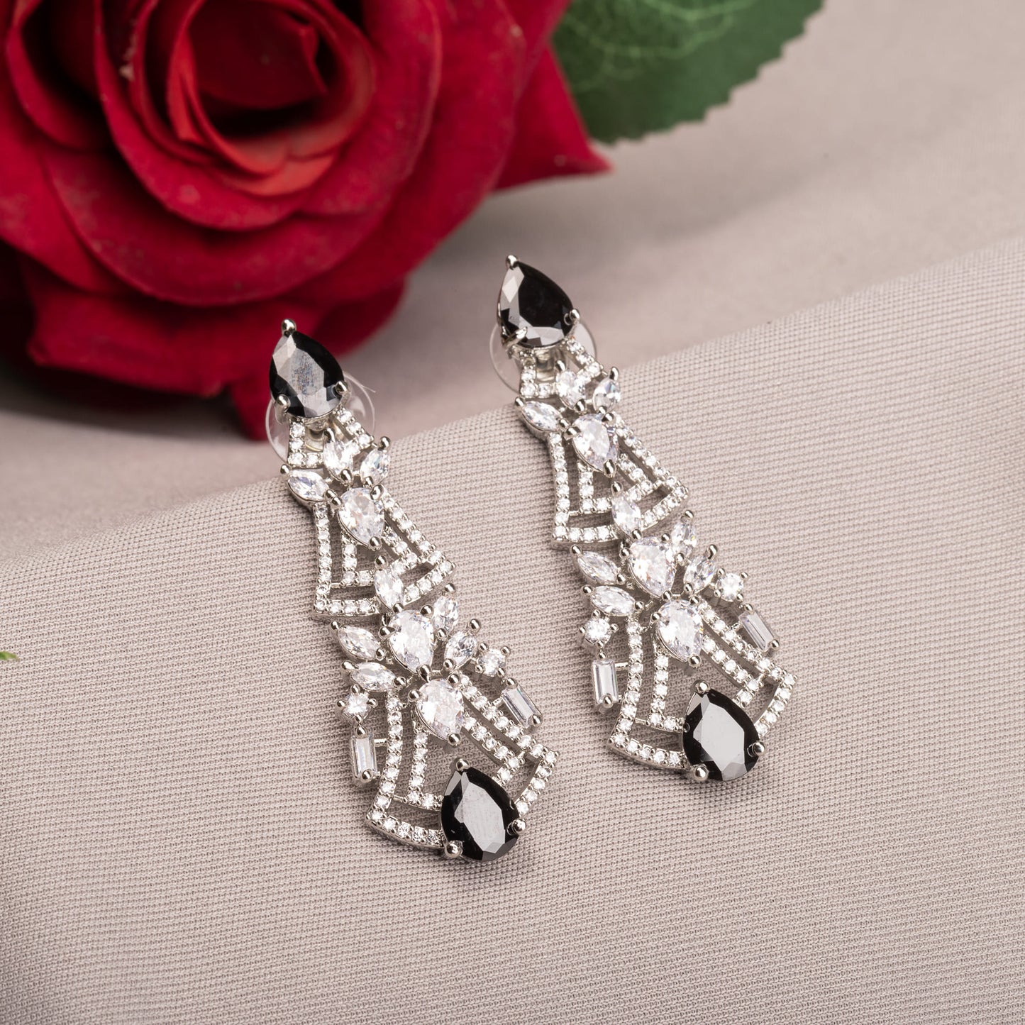 EARRINGS WITH BLACK AND WHITE ZIRCON CREATE A DRAMATIC, ELEGANT CONTRAST