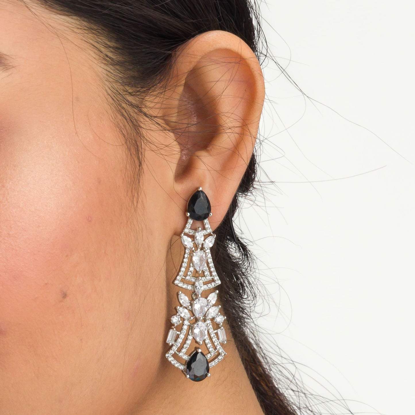 EARRINGS WITH BLACK AND WHITE ZIRCON CREATE A DRAMATIC, ELEGANT CONTRAST