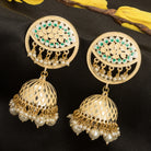 "Gold-tone jhumka with a green accent adds a vibrant twist to traditional style."
