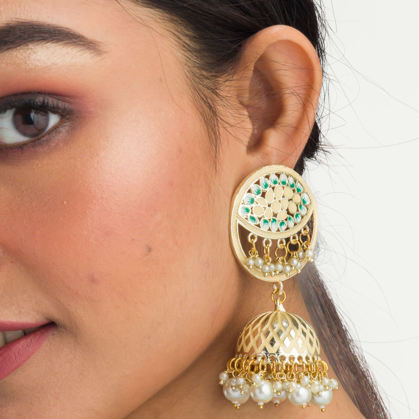 GOLD POLISH JHUMKA WITH A MEEANAKARI DESIGN CRAFTED  ADDS A VIBRANT AND ELEGANT TWIST TO TRADITIONAL STYLE.