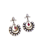 "Oxidized studs with red and white stones create a striking vintage-inspired contrast."
