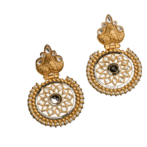 "Gold-tone earrings with black pearl add elegant warmth and striking contrast to any outfit."
