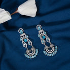 1. "Blue zircon earrings shine with captivating sparkle and a rich, vibrant hue for a stunning effect."
