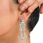 1. "Blue zircon earrings shine with captivating sparkle and a rich, vibrant hue for a stunning effect."
