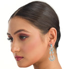 1. "Blue zircon earrings shine with captivating sparkle and a rich, vibrant hue for a stunning effect."
