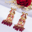 "Ganesh idol earrings with kundan and gold-tone polish add classic charm and grace."
