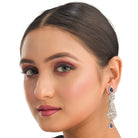 "Navy blue zircon earrings add a vibrant, elegant sparkle to your ensemble."
