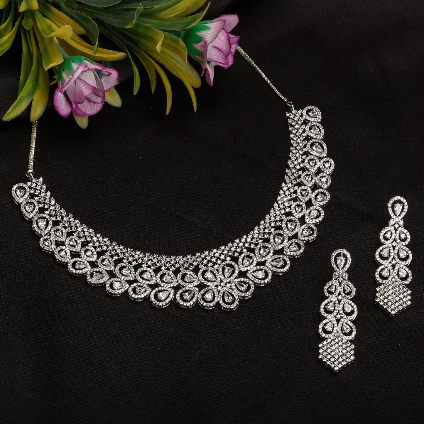 THE ZIRCON HEAVY NECKLACE BOASTS STRIKING BRILLIANCE AND BOLD ELEGANCE PAIRED WITH MATCHING EARRINGS