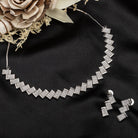 "Zigzag-shaped zircon necklace adds a modern twist to classic sparkle."
