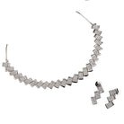 "Zigzag-shaped zircon necklace adds a modern twist to classic sparkle."
