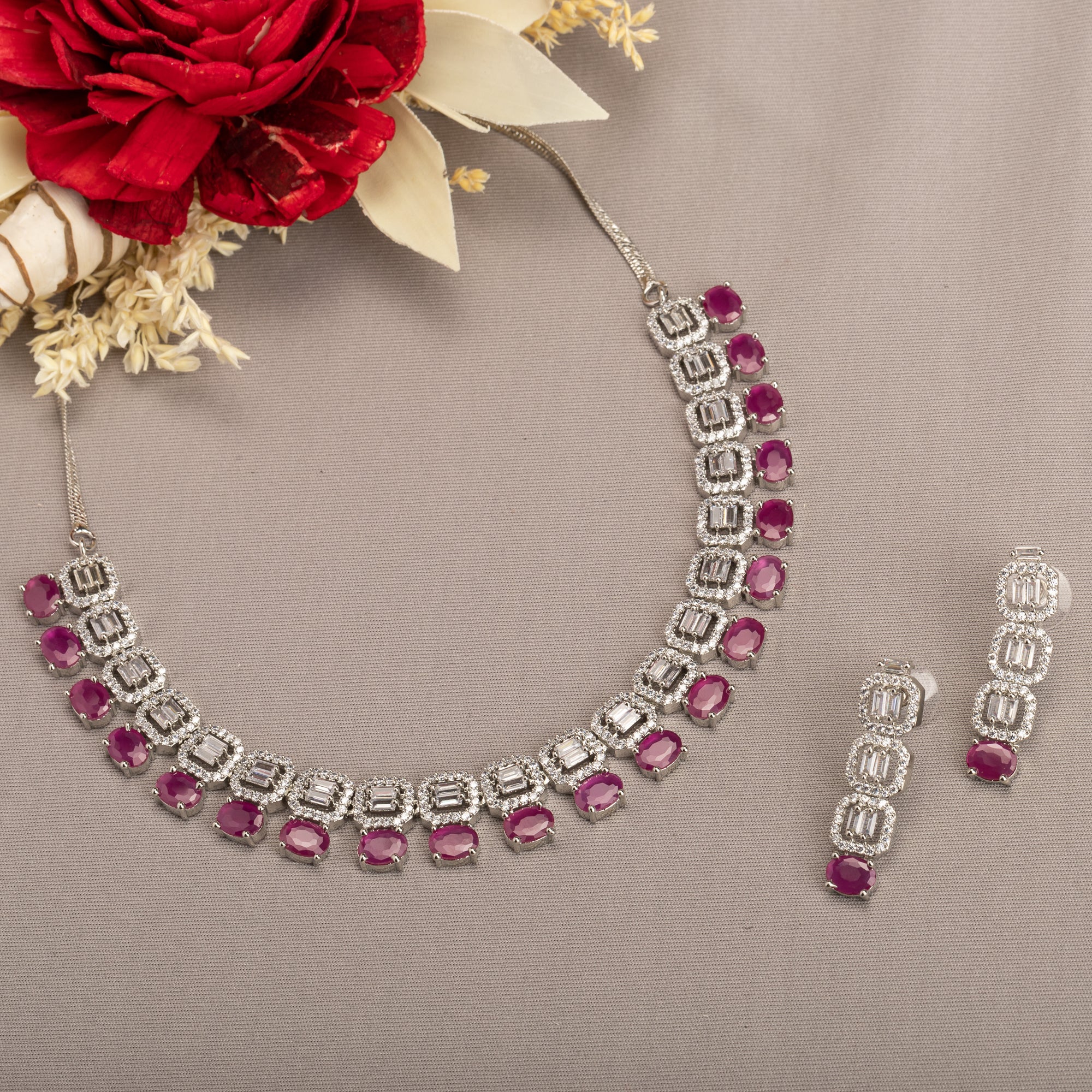 "Pink zircon necklace set features vibrant, elegant charm."
