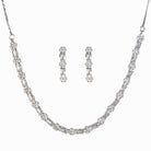 "Delicate zircon necklace with small flower design adds elegance and sparkle."
