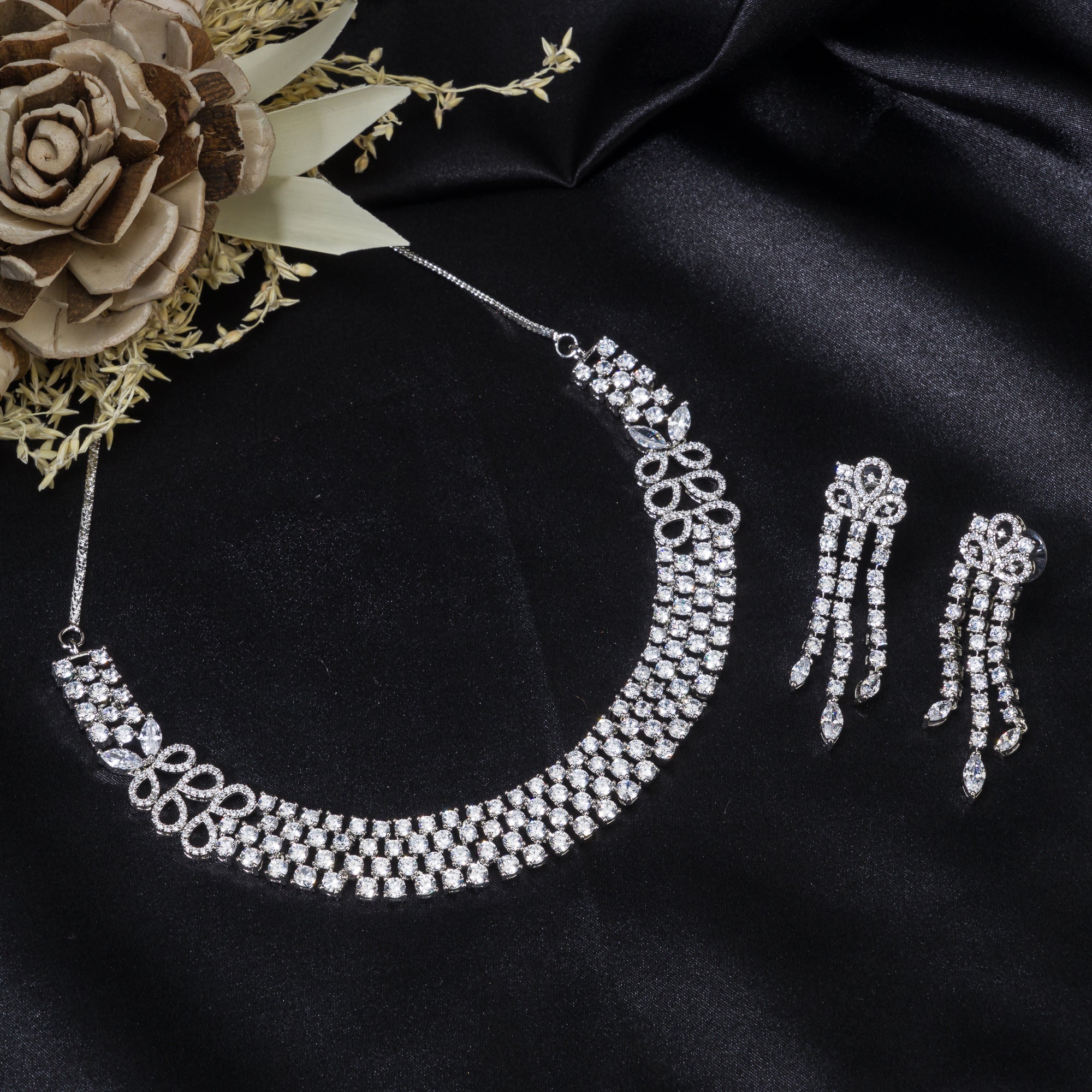 "Zircon necklace with infinity design symbolizes timeless elegance."
