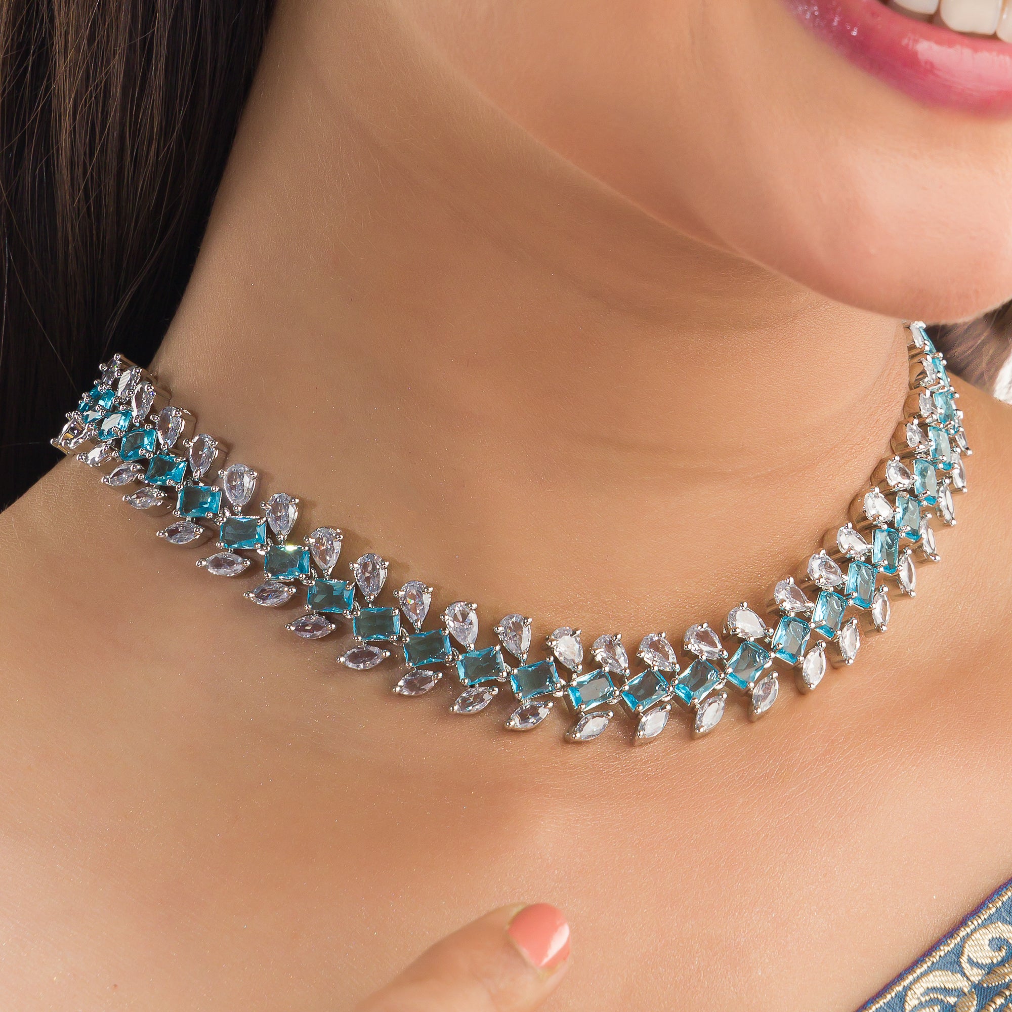 "Aqua blue zircon necklace with square stone offers a vibrant, stylish touch."
