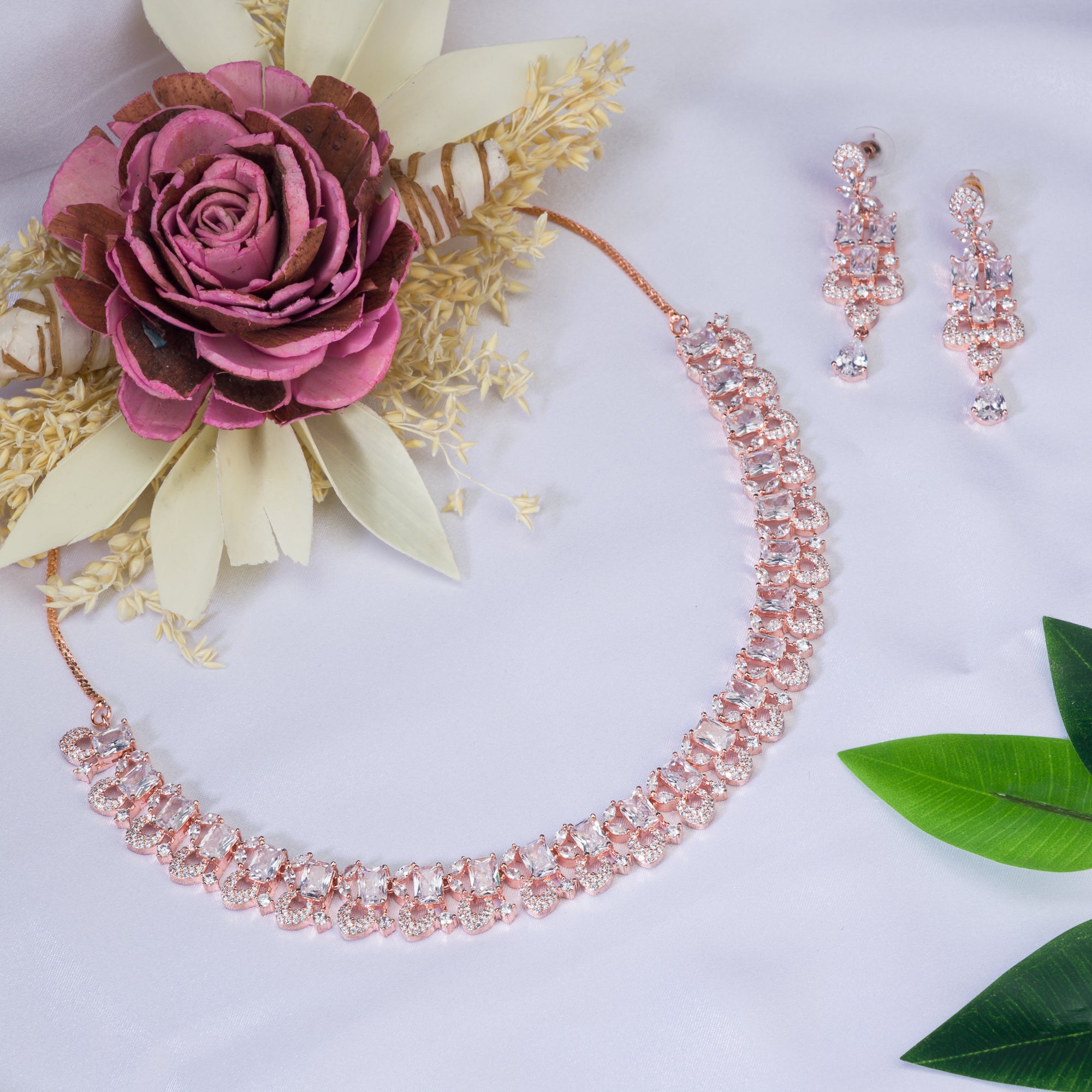 "Understated zircon necklace in silver and rose gold adds timeless elegance."
