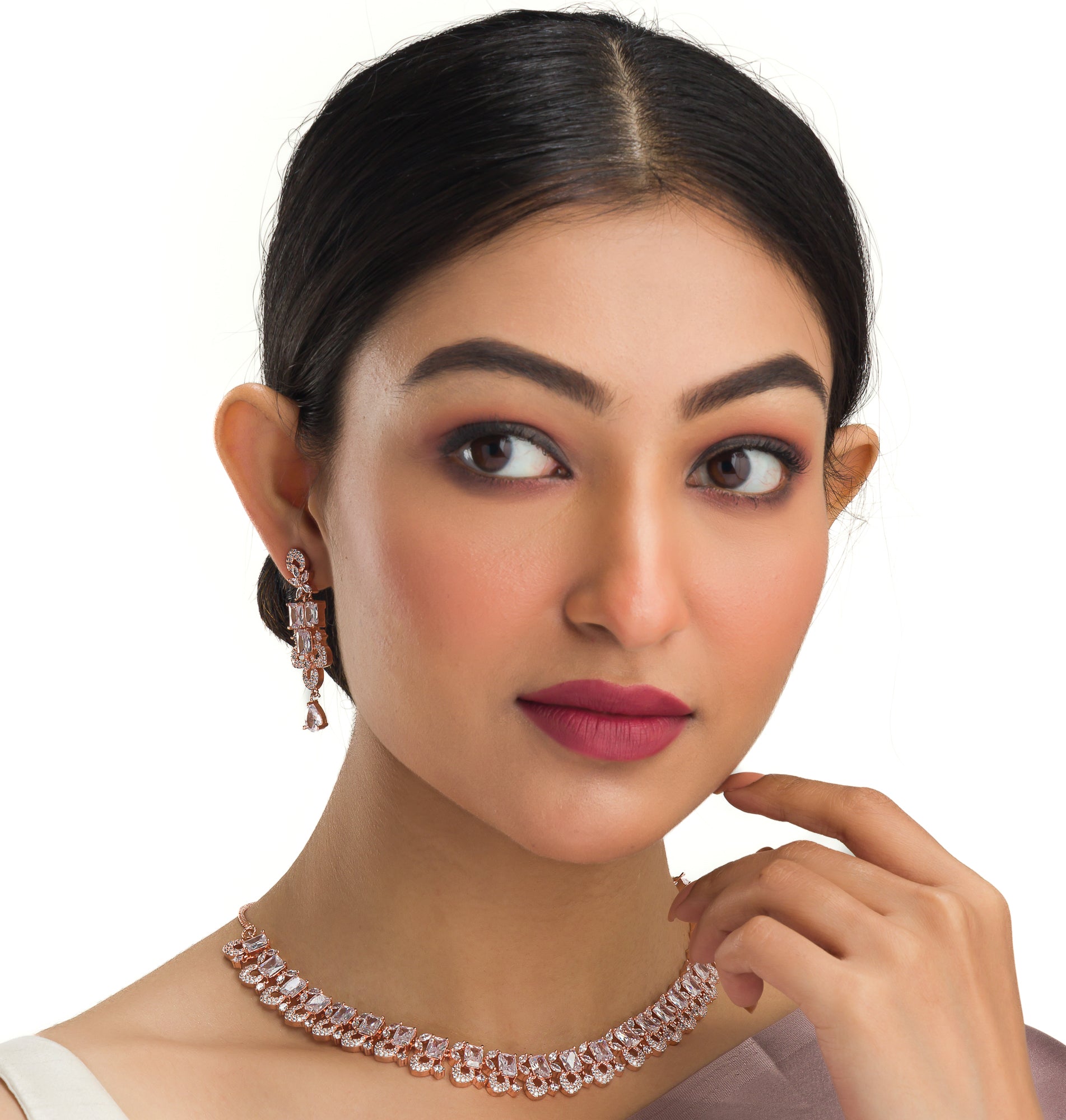 "Understated zircon necklace in silver and rose gold adds timeless elegance."
