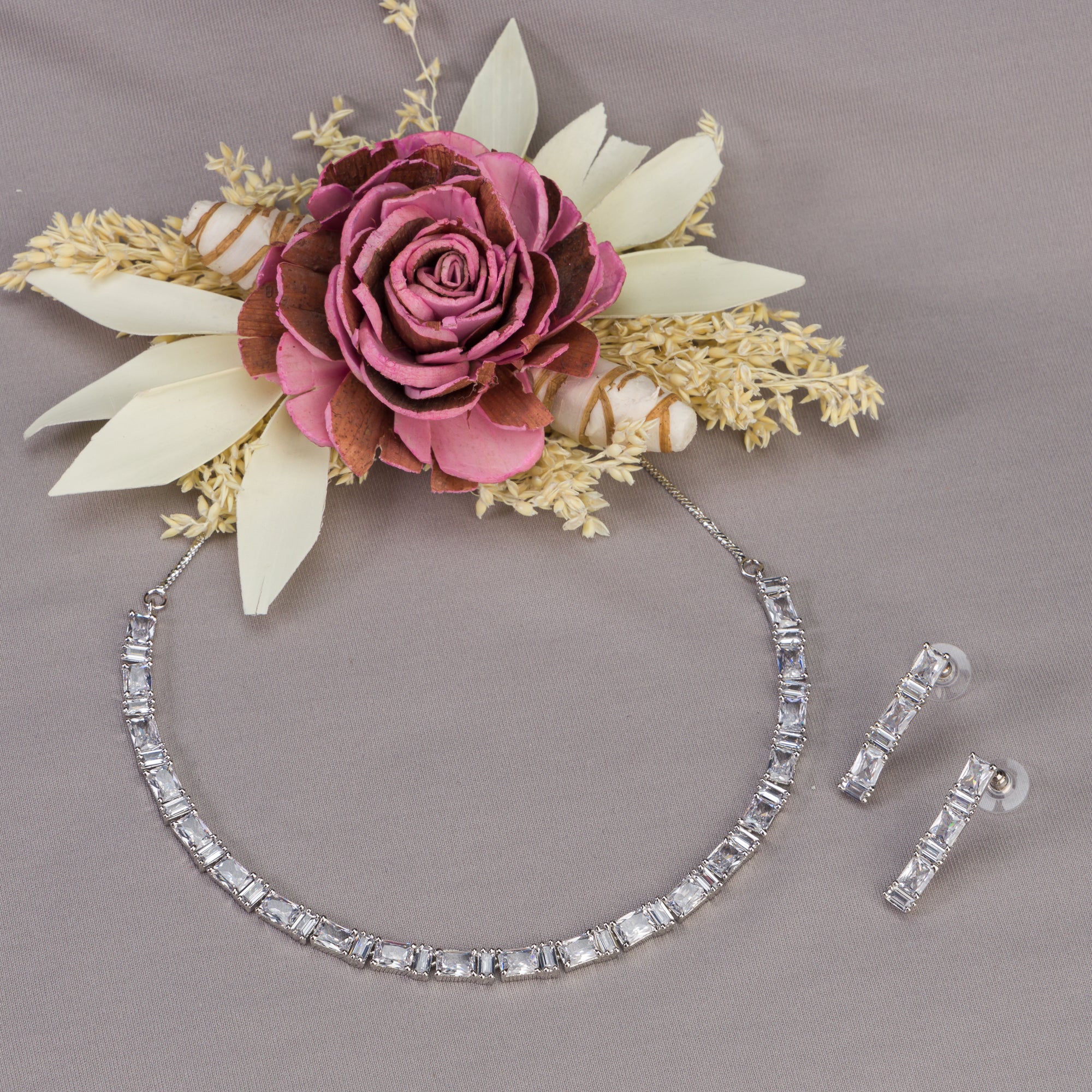 "Zircon necklace in silver offers a classic, understated elegance."
