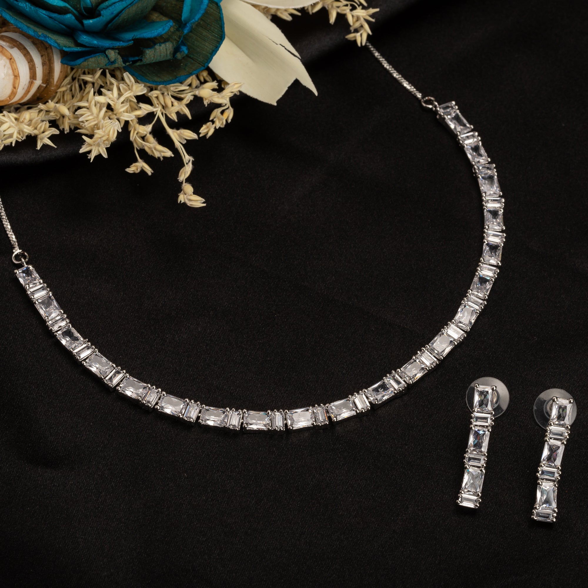 "Zircon necklace in silver offers a classic, understated elegance."
