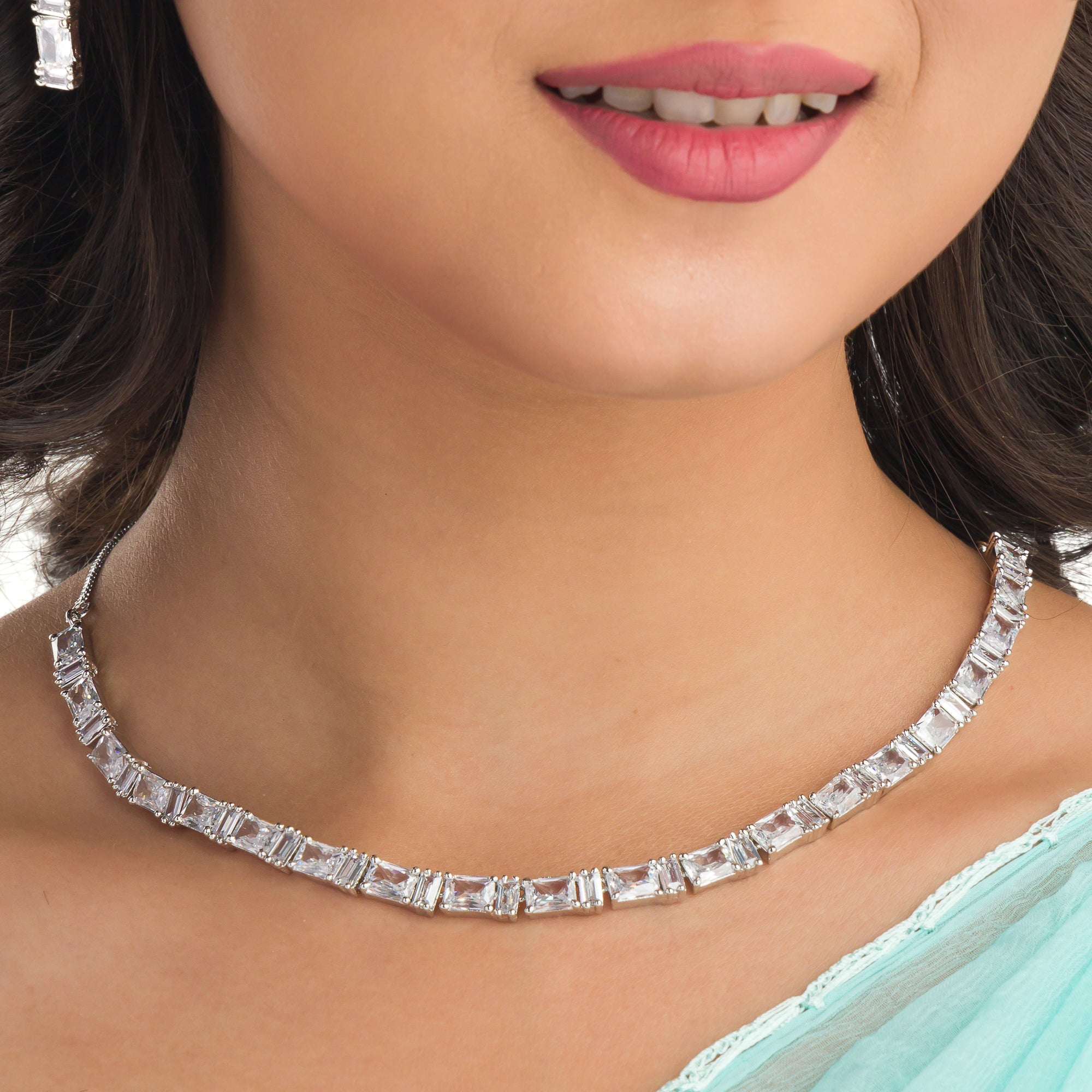 "Zircon necklace in silver offers a classic, understated elegance."
