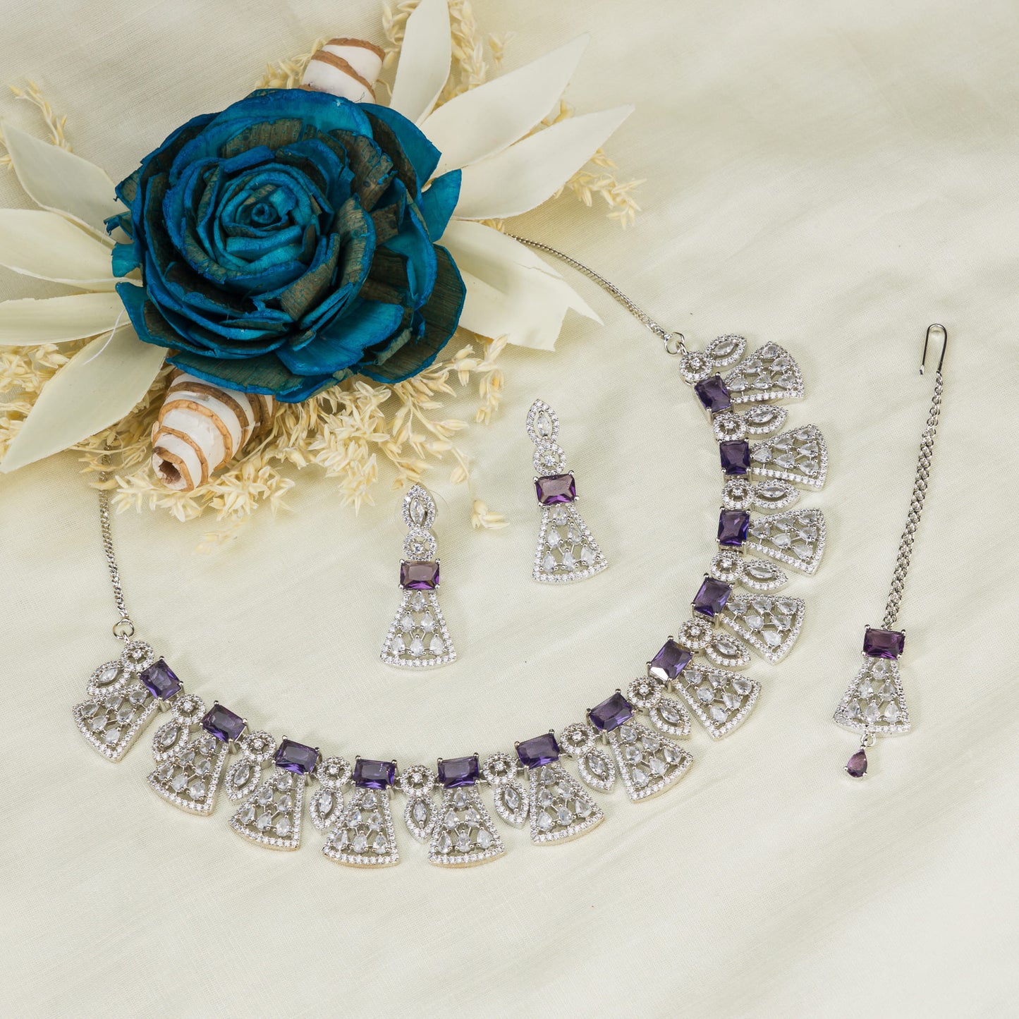 ZIRCON NECKLACE SET WITH MAANG TIKKA EXUDES ELEGANT COORDINATION.