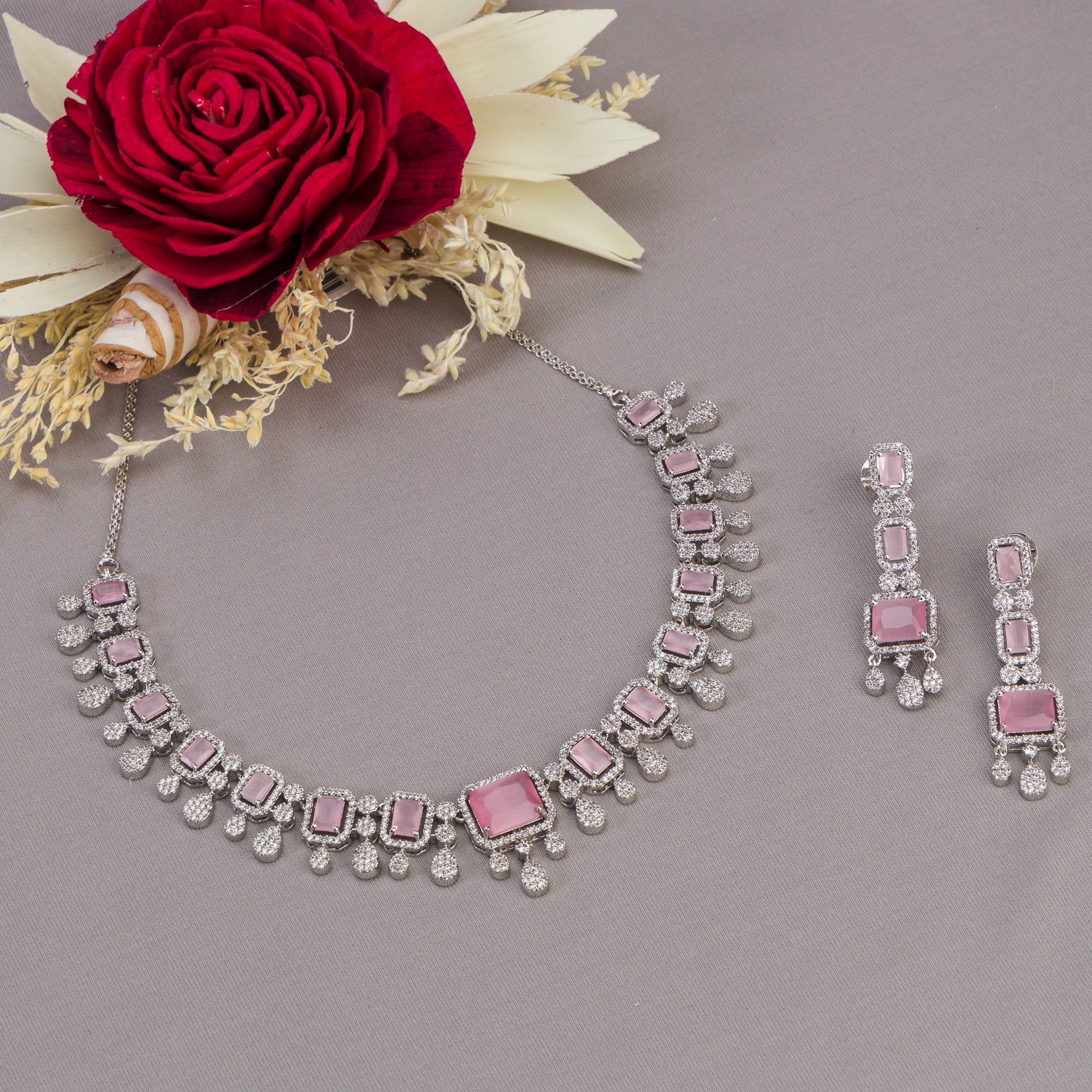 "Pink zircon necklace with square stone adds a bold, elegant touch to any outfit."
