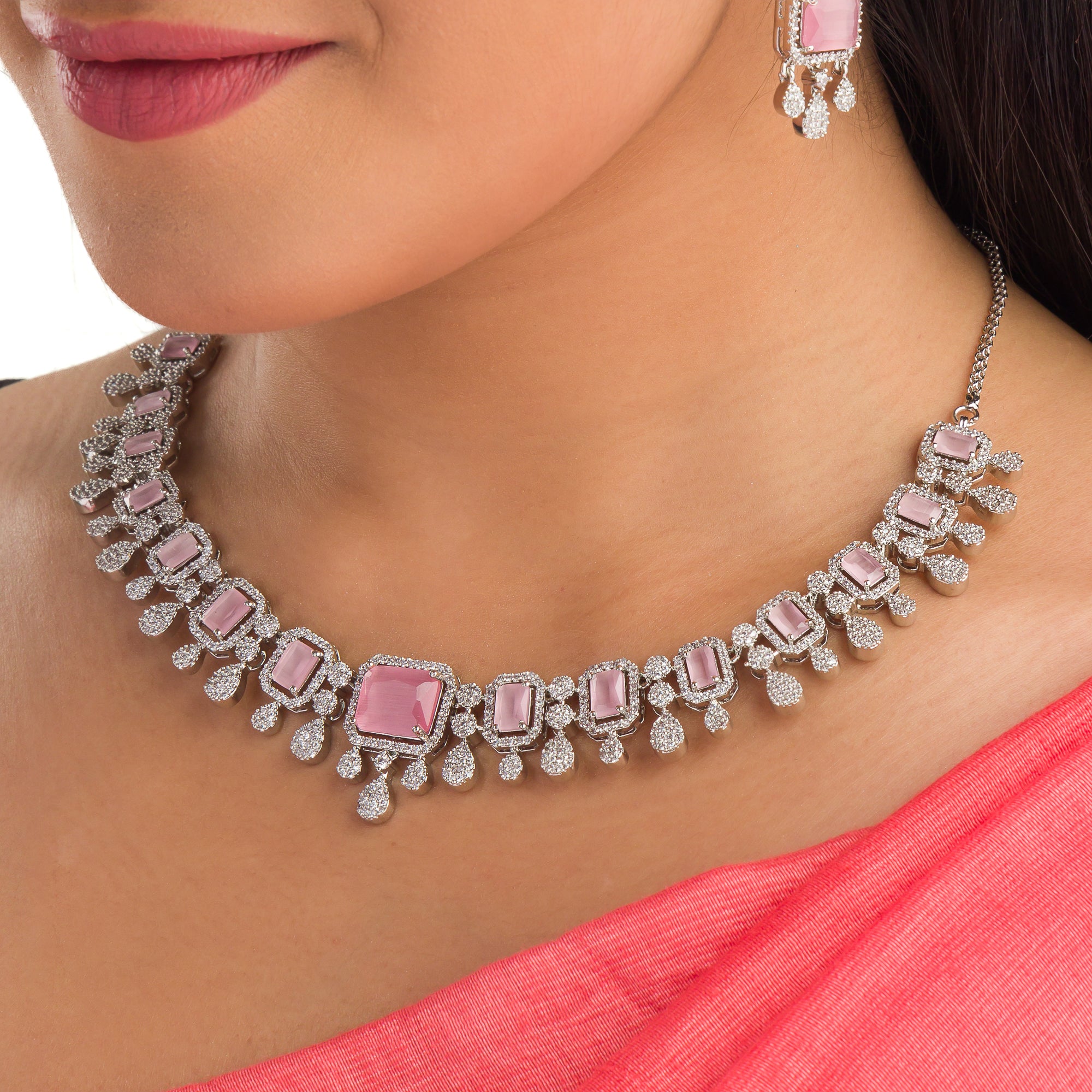 "Pink zircon necklace with square stone adds a bold, elegant touch to any outfit."
