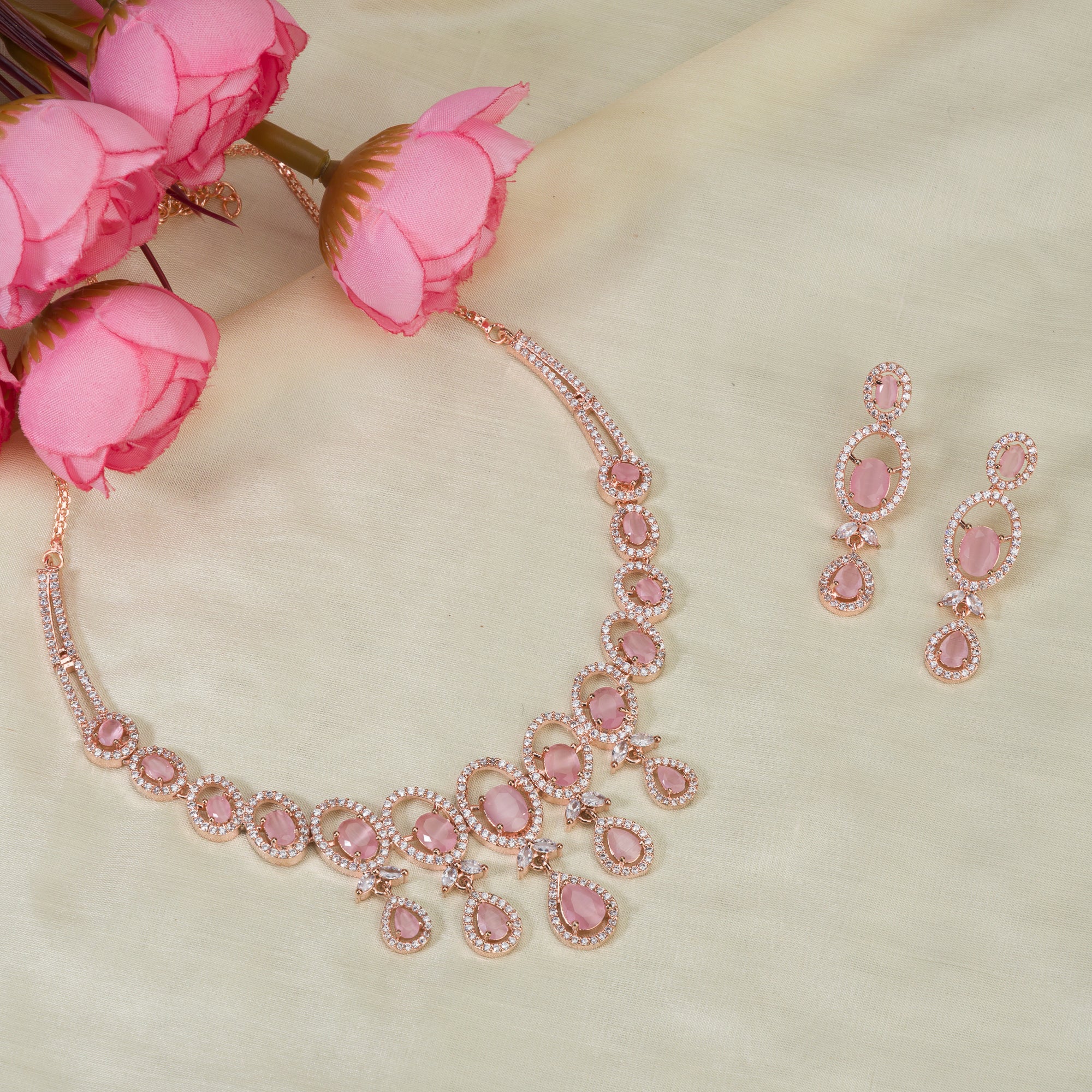 Pink zircon necklace with rose gold polish adds a chic and elegant finishing touch
