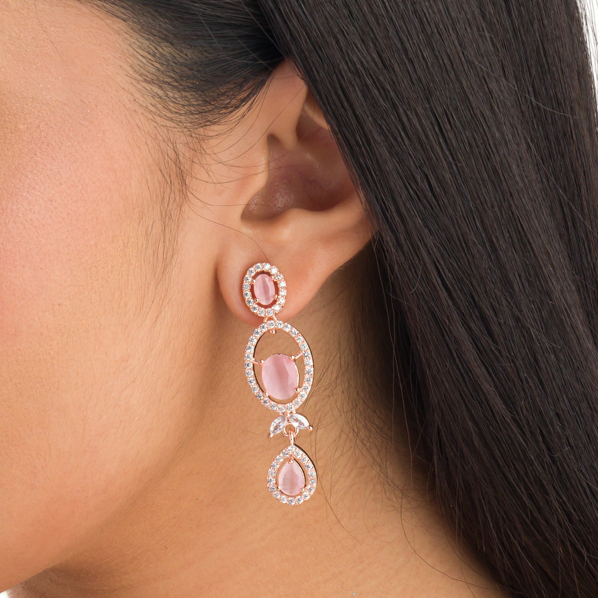 Pink zircon necklace with rose gold polish adds a chic and elegant finishing touch
