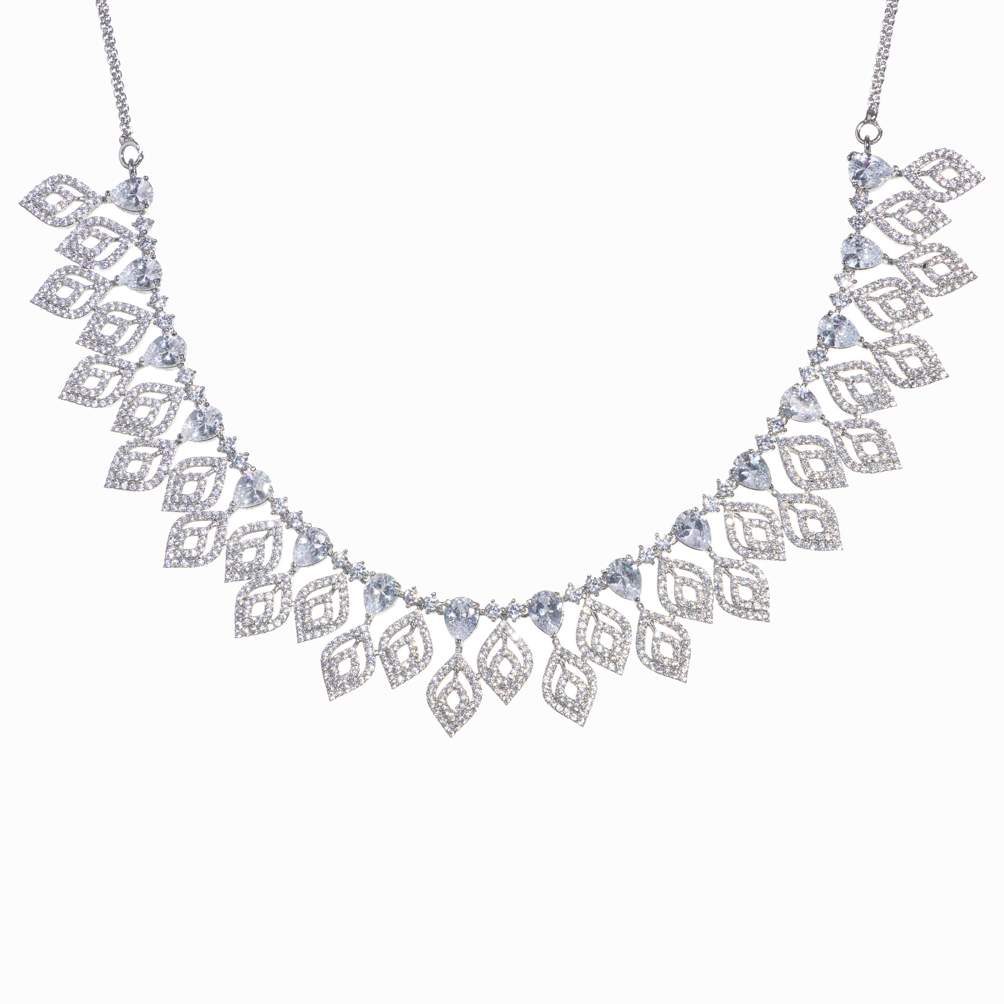 "Silver zircon necklace with leaf motifs adds natural elegance and sophisticated charm."
